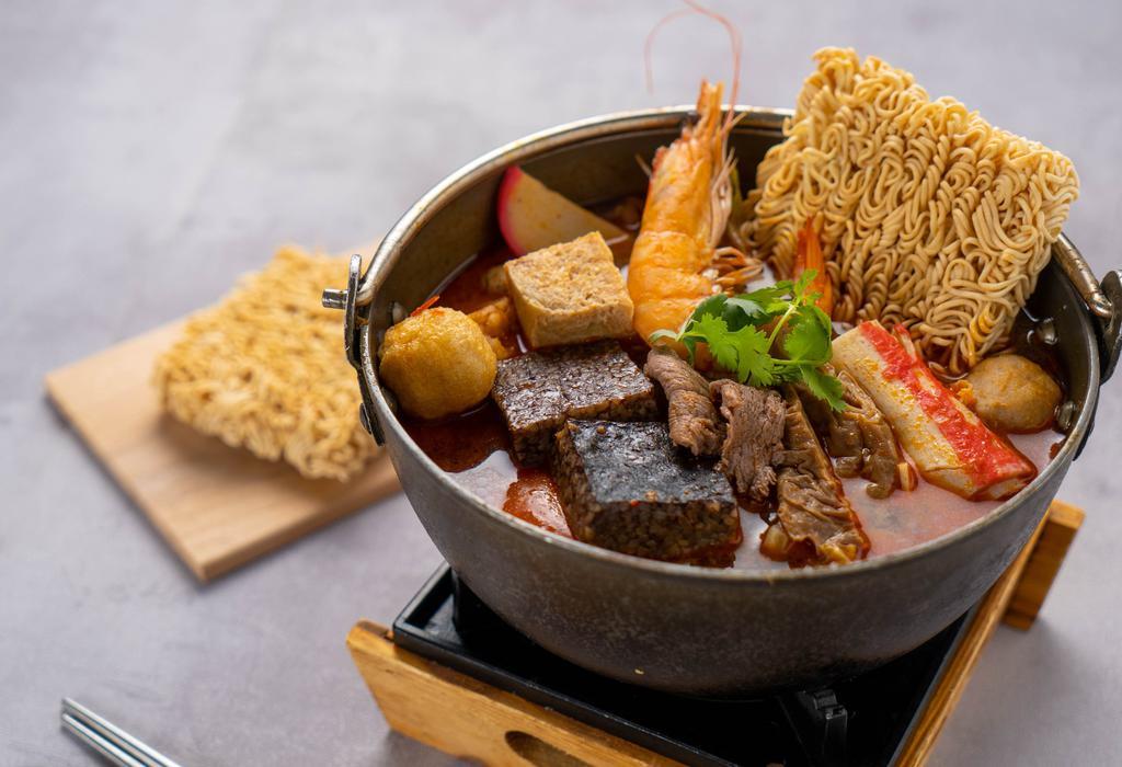 H9. Taiwanese Spicy Pot 台式麻辣鍋 · Spicy. Chef recommendation. Beef, pork intestine, pork blood cake, quail egg, meatball, kamaboko, clam, fish cake, imitation crab, shrimp, fish ball, tofu, instant noodle, assorted mushrooms, assorted vegetables.