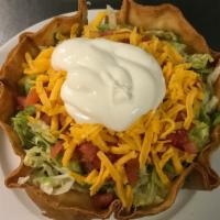 Regular Sombrero · Rice, beans, meat, lettuce, tomatoes, cheese, and sour cream.