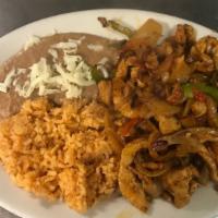 Fajitas · Sliced grilled steak, chicken or shrimp, served with bell peppers, onions, and soft tortilla.