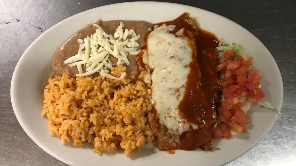 Enchilada · Corn tortilla filled with meat or cheese and topped with red sauce and cheese.
