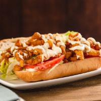 Fried Clam Po'boy · Deep fried clam strips, tartar sauce, lettuce and tomato on a French roll. High source of pr...