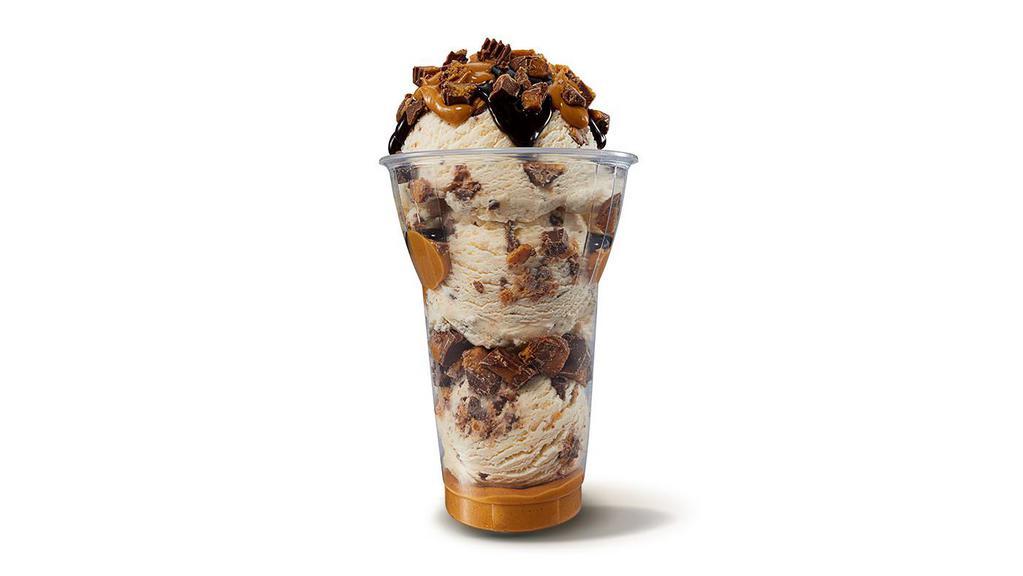 REESE'S® Peanut Butter Cup Layered Sundae · Three scoops of Reese’s Peanut Butter Cup ice cream topped with layers of Reese's Peanut Butter Sauce, chopped Reese's Peanut Butter Cups, and hot fudge!