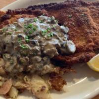 Schnitzel · Breaded Duroc pork, mushroom gravy and warm potato salad