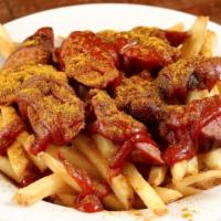 Berliner - Currywurst · sliced sausage of your choice atop fries with curry ketchup