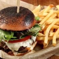 Cheeseburger · Grass-fed beef, jack & house beer cheese, lettuce, tomato, onion, and pickles, served with f...