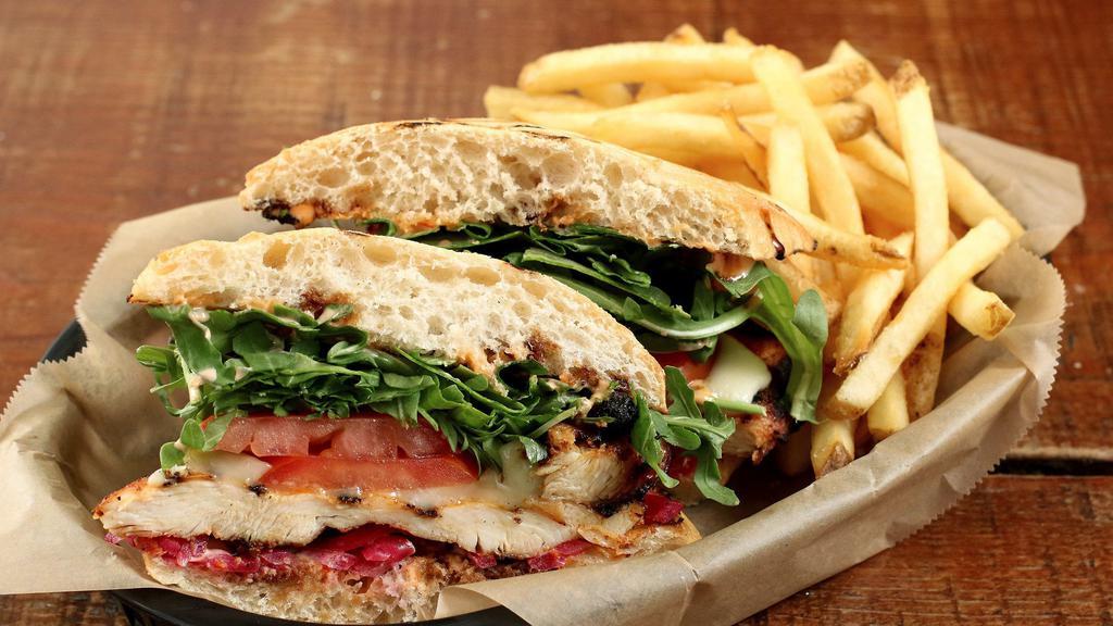 Grilled Chicken Sandwich · Marinated grilled chicken breast, jack cheese, arugula, tomato, balsamic glaze, and a garlic pepper mayo.  Served with fries.