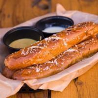 Hot Grilled Pretzel Sticks · served w/ house beer cheese & honey mustard dipping sauce