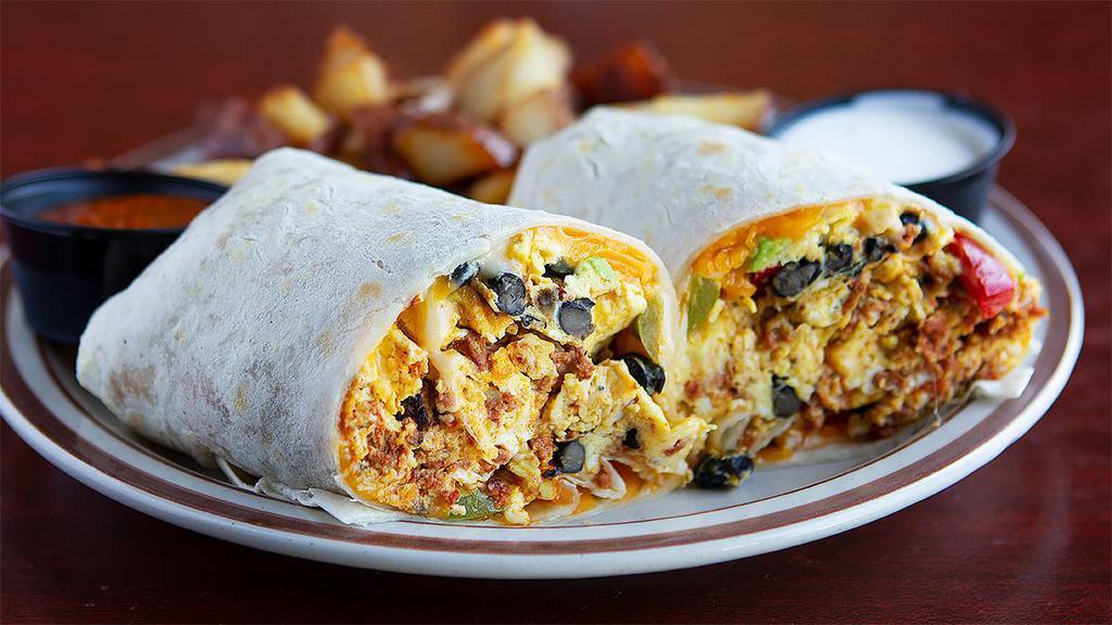 Breakfast Burrito · Scrambled eggs, chorizo, bell peppers, cilantro, avocado, beans and cheddar cheese with sour cream and salsa. Served with choice of side.