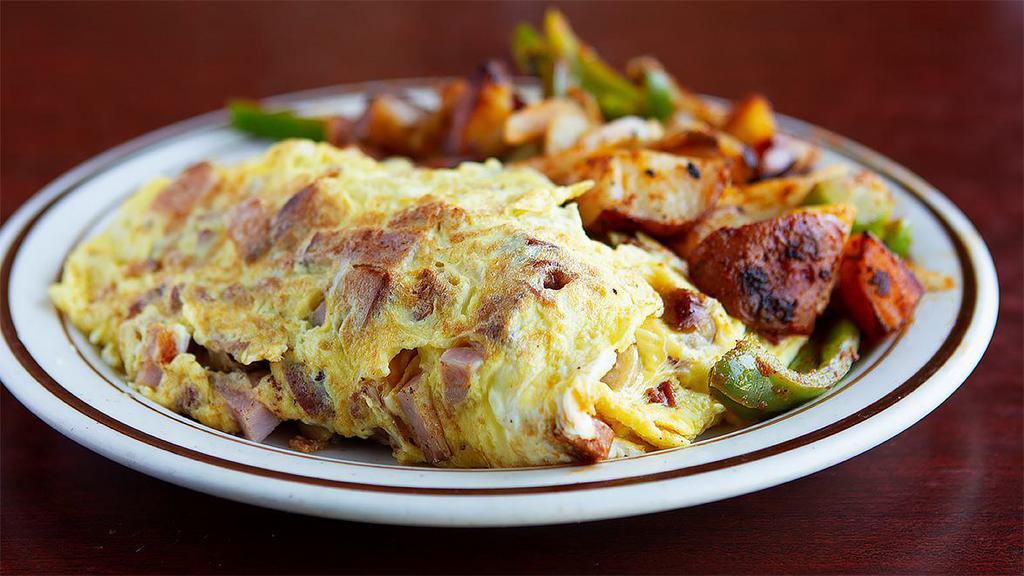 The Supreme Omelette · Linguica, sausage, bacon, ham, cheddar jack and Swiss cheese. 4 egg omelette with choice of side and toast.