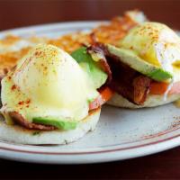 California Benedict · Poached eggs, avocado, bacon, tomato and Hollandaise sauce on a toasted muffin. Served with ...