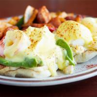 Crab, Prawns and Avocado Benedict · Crab, prawns avocado and Hollandaise sauce on a toasted muffin.  Served with choice of side.