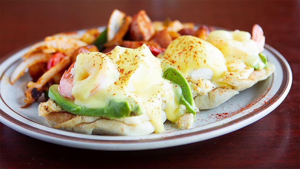 Crab, Prawns and Avocado Benedict · Crab, prawns avocado and Hollandaise sauce on a toasted muffin.  Served with choice of side.