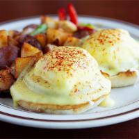 Traditional Benedict · Canadian bacon, poached eggs and hollandise sauce on a toasted muffin. Served with choice of...