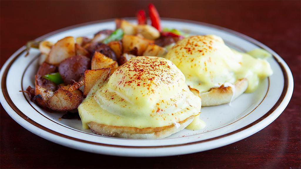 Traditional Benedict · Canadian bacon, poached eggs and hollandise sauce on a toasted muffin. Served with choice of side.