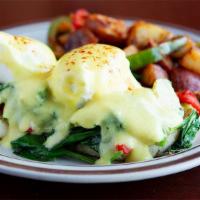 Castro Benedict · Spinach, artichoke, eggs and Hollandaise sauce on a toasted muffin.  Served with choice of s...