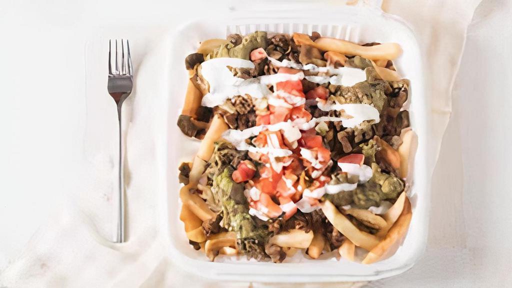 Carne Asada Fries · French Fries topped with choice of Meat, Guacamole, Melted Cheese, Pico de
Gallo & Sour Cream