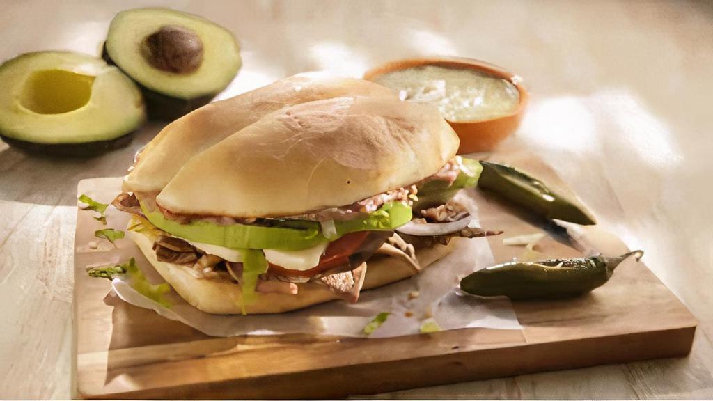 Torta · Choice of Meat, topped with Beans, Tomatoes, Onions, Lettuce, 
Avocado, Queso Fresco & Mayo