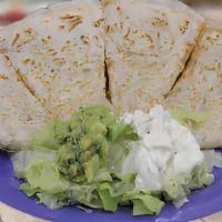 Regular Quesadilla · Choice of Flour or Corn Tortilla, filled with Melted Cheese served with Lettuce & Sour Cream