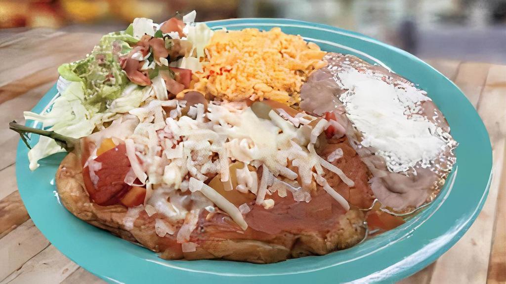 Chile Relleno · Chile Pasilla Pepper-stuffed with Cheese and drizzled with Mild Red Sauce. 
Served with Rice, Beans, Pico de Gallo & Lettuce.