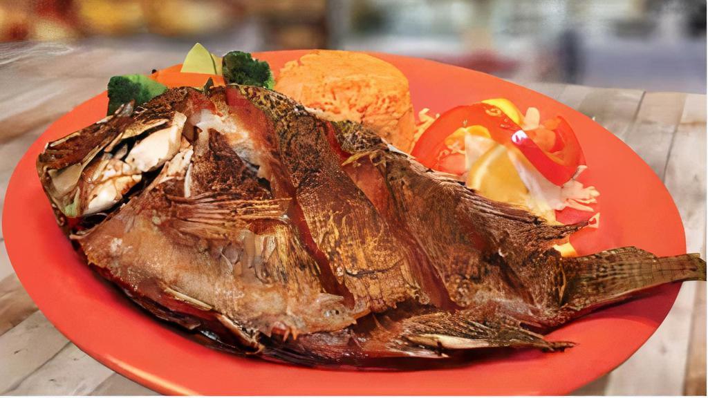 Pescado Frito · Deep fried Talapia Fish, served with Rice, Vegetables, Pico de Gallo & Lettuce