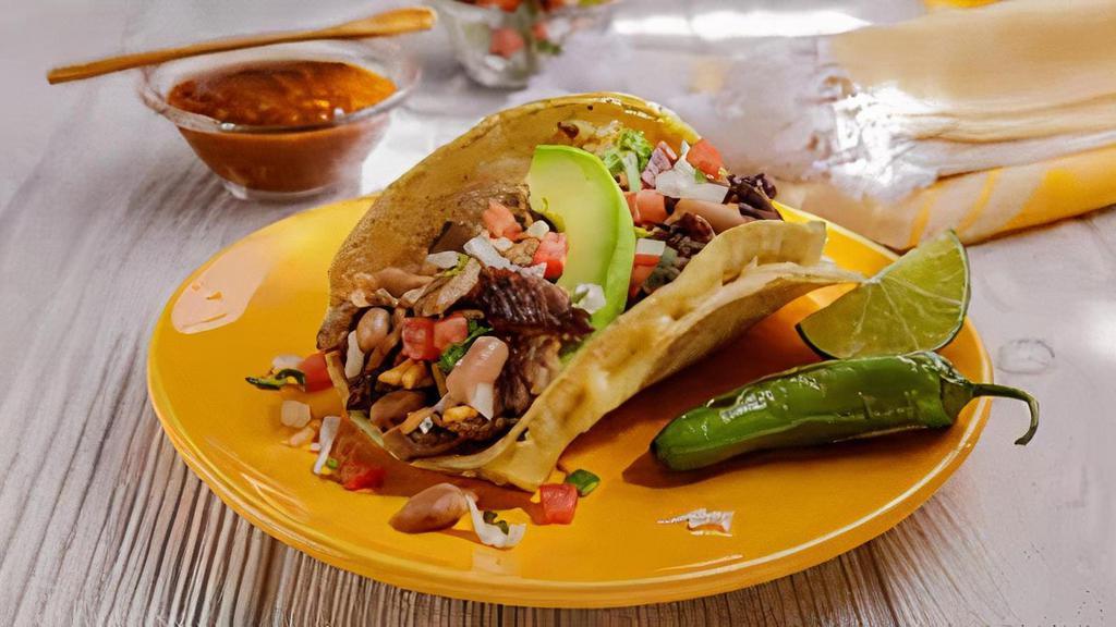 Super Taco · Choice of Meat, Rice, Whole Beans, Melted Cheese, Avocado & Pico de Gallo