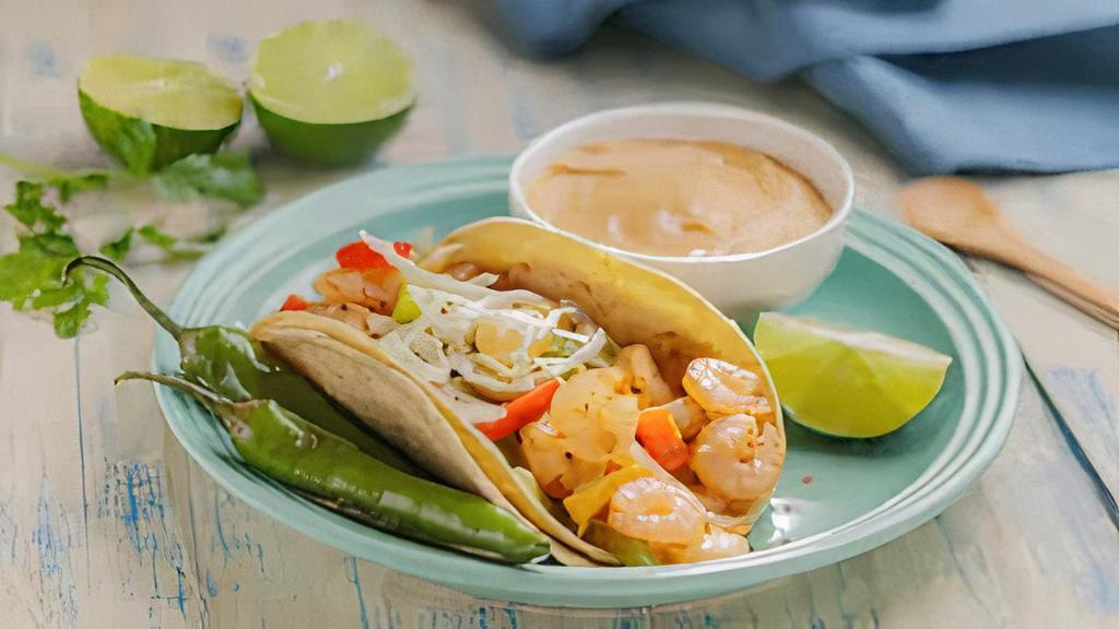 Taco Del Mar · Shrimp or Fish, Grilled Onions, Bell Peppers, Cabbage, Pico de Gallo
& Chipotle Sauce