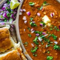Pav Bhaji · Popular Indian street food where breakfast buns are served with spicy mashed veggies topped ...