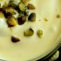 Saffron Pistachio Lassi · Chefs special blend on a traditional yogurt based drink with  earthiness of the saffron, com...
