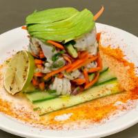 Shrimp Ceviche · Fresh shrimp marinated tossed with lime, tomatoes, carrots, cucumbers and cilantro, topped w...
