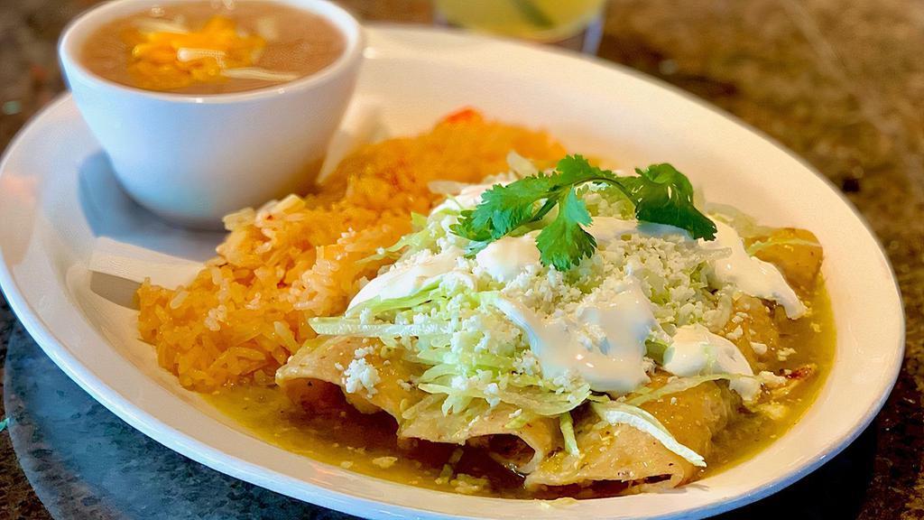 Chicken Enchiladas · Hand-rolled, served with choice of red or green sauce, rice and charro beans.