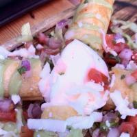 Chicken Taquitos · Lettuce, pico, avocado salsa, sour cream, queso fresco