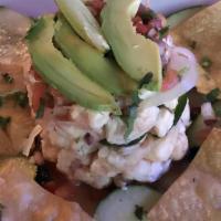 Shrimp Ceviche · Shrimp cured in lime juice, spicy serrano's, onion, cilantro, cucumber, avocado, and spice.