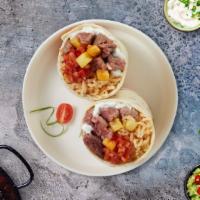 The Green Cali Burrito · Tomato tortilla with lettuce, sauteed veggies, black beans, rice, pico de gallo, guacamole a...