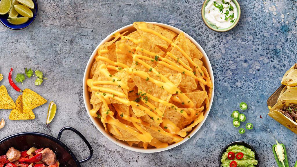 Nacho Bongo · Homemade corn chips topped with nacho cheese and pickled jalapeños.