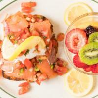 Open Faced Sandwich · smoked salmon, caper, lemon, avocado, poached egg on a toasted garlic sourdough, covered wit...