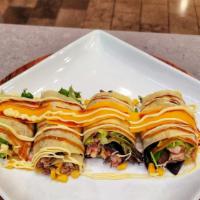 American Beef Hash Crepe · All-American style beef hash crepe with corned beef hash, cheddar cheese, corn, egg, and sou...