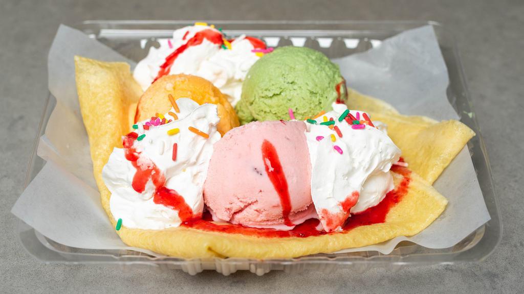 Strawberry & Mango & Vanilla Ice Cream Crepe · Includes: 3 ice cream scoops, nutella, powdered sugar, chocolate syrup, & whipped cream.