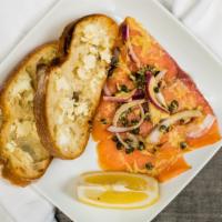 Crostini di Salmone · Smoked salmon with goat cheese and caper berries.