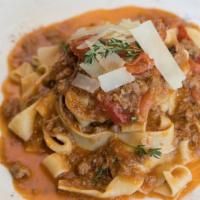BOLOGNESE · Traditional beef & pork “sugo”, tagliatelle egg
noodles, Italian tomatoes, Grana Padano chee...