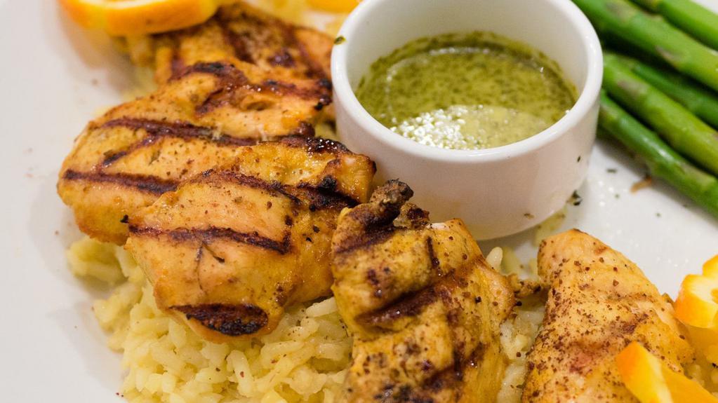 Chicken Shish Kabob · cubes of chicken breast marinated in special spices
skewered, flame-broiled served on a bed of baked basmati rice. served with a side of spicy cilantro sauce.