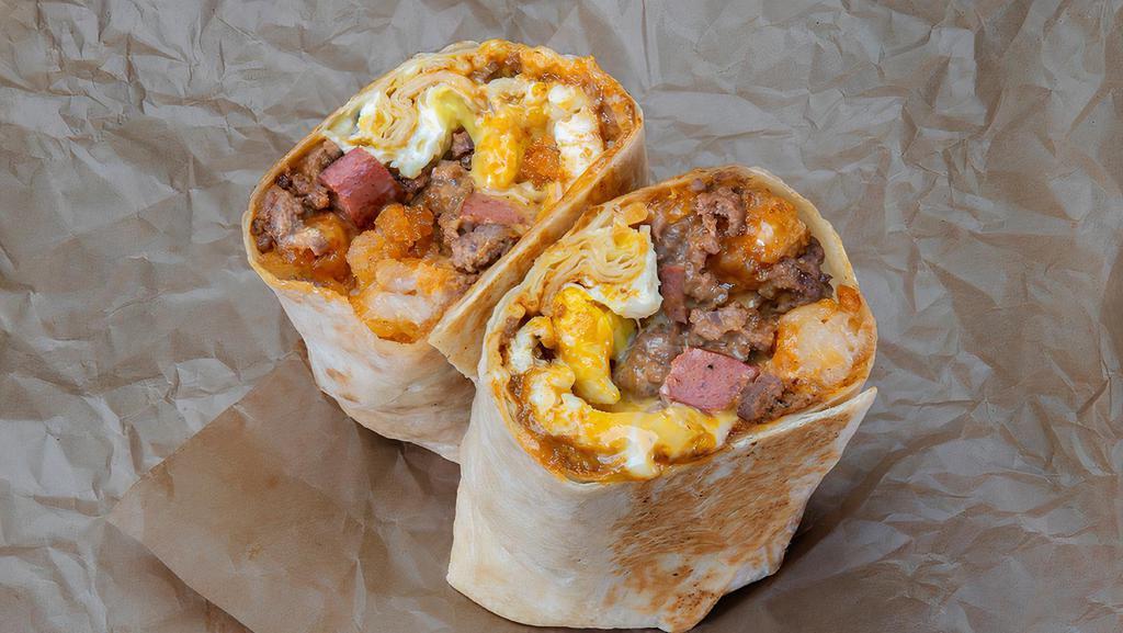 Stoney Baloney Breakfast Burrito · Food Network Chef Adam Gertler’s Stoney Baloney Breakfast Burrito comes stuffed with 3 sunny side up eggs, a 100% Black Angus beef patty, our craft 100% all-beef dog, chili, white american cheese, cheese sauce, crispy tater tots, onion, and spicy mayo, wrapped in a flour tortilla.