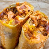 Haus Breakfast Burrito · Eggs, smoked bacon, white American cheese, crispy tater tots, caramelized onions, spicy mayo...