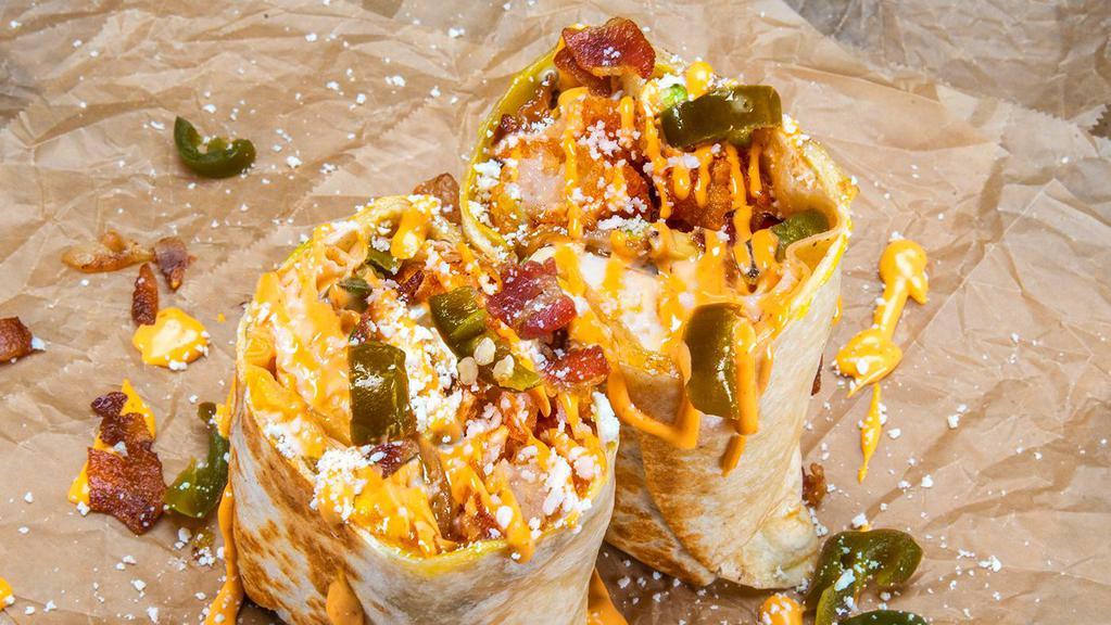 Bronco Burrito · 3 eggs, smoked bacon, white American cheese, avocado, pickled jalapenos, crispy tater tots, cotija cheese, and chipotle aioli. Sides of chipotle aioli and hot sauce.