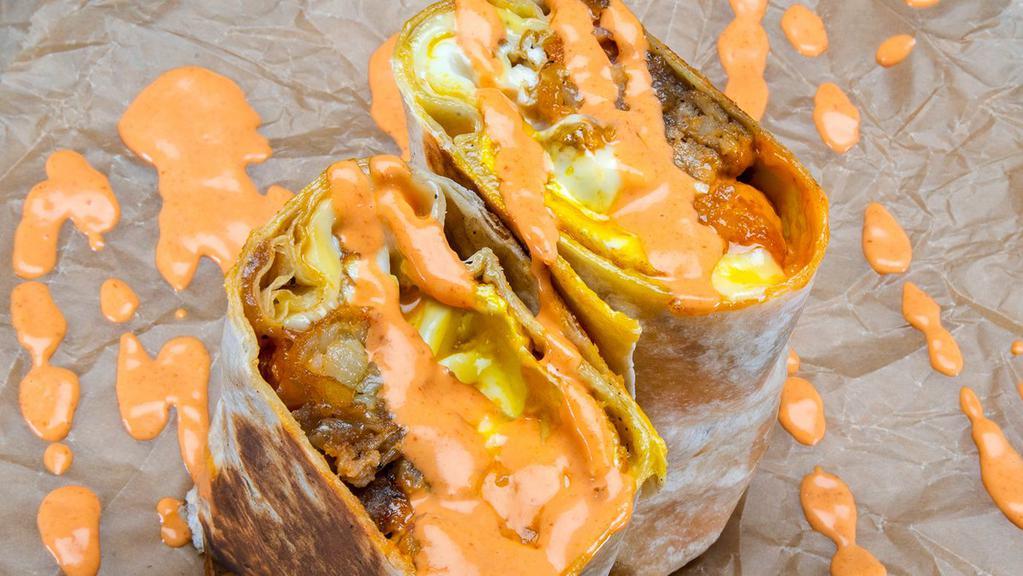 Würst Burrito · 3 eggs, choice of Haus sausage, white american cheese, crispy tater tots, caramelized onions, spicy mayo.