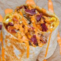 Pastrami Burrito · 3 eggs, pastrami, white american cheese, crispy tater tots, spicy mayo sides of spicy mayo &...