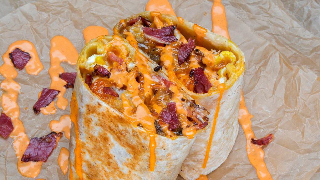 Pastrami Burrito · 3 eggs, pastrami, white american cheese, crispy tater tots, spicy mayo sides of spicy mayo & hot sauce.