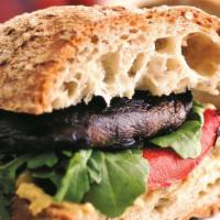 Grilled Portobello Mushroom · Roasted garlic aioli, sprouts, and tomatoes, served on foccacia.