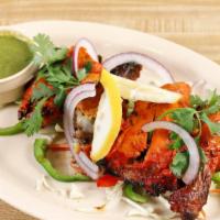 Tandoori Chicken Leg · Punjabi style marinated chicken cooked in a clay oven two pieces.