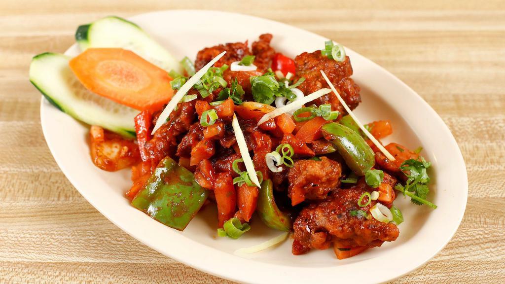 Chilli Chicken · Batter fried chicken toss in a chilli sauce along with bell peppers.