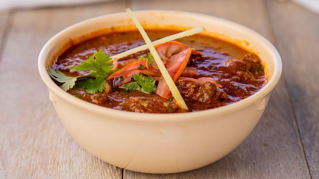 Kashmiri Lamb · Lamb cooked in a onion tomato sauce along with Indian spices.